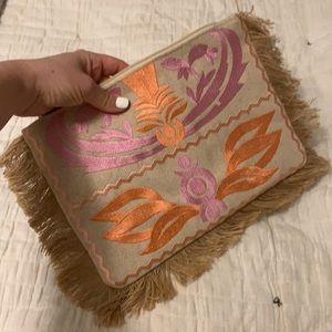 Embroidered clutch with fringe detail